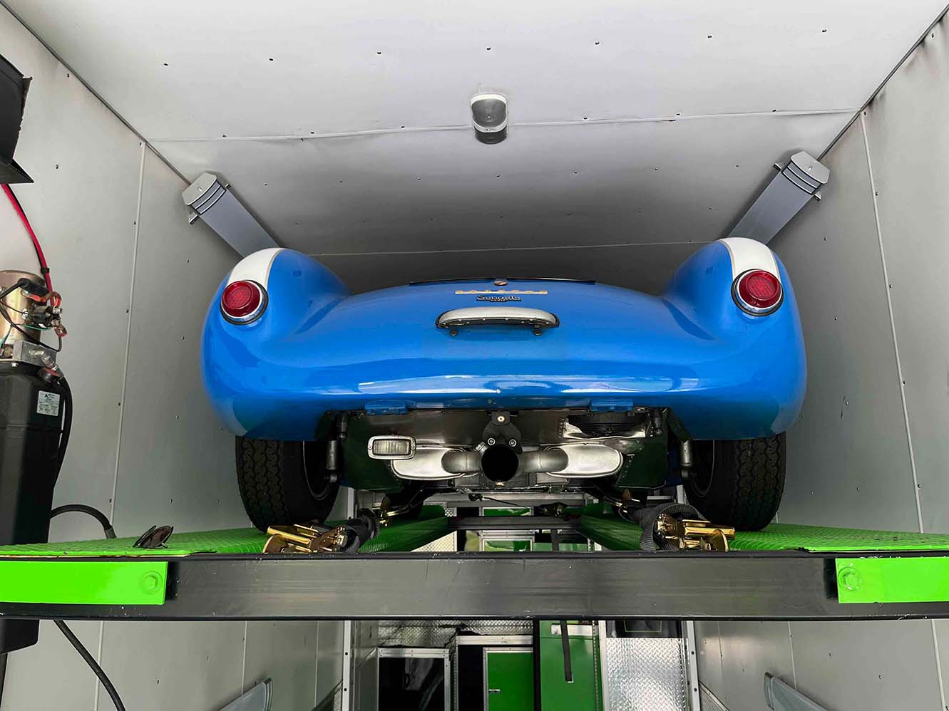 Porsche 550 on lift, after raising